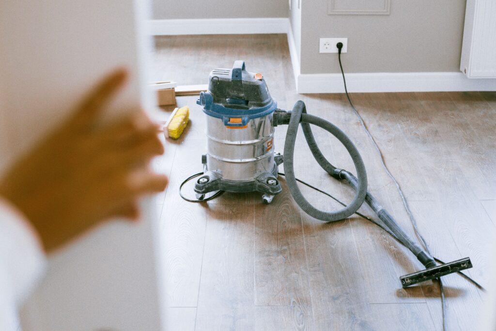 Professional cleaning vacuum on wooden floor