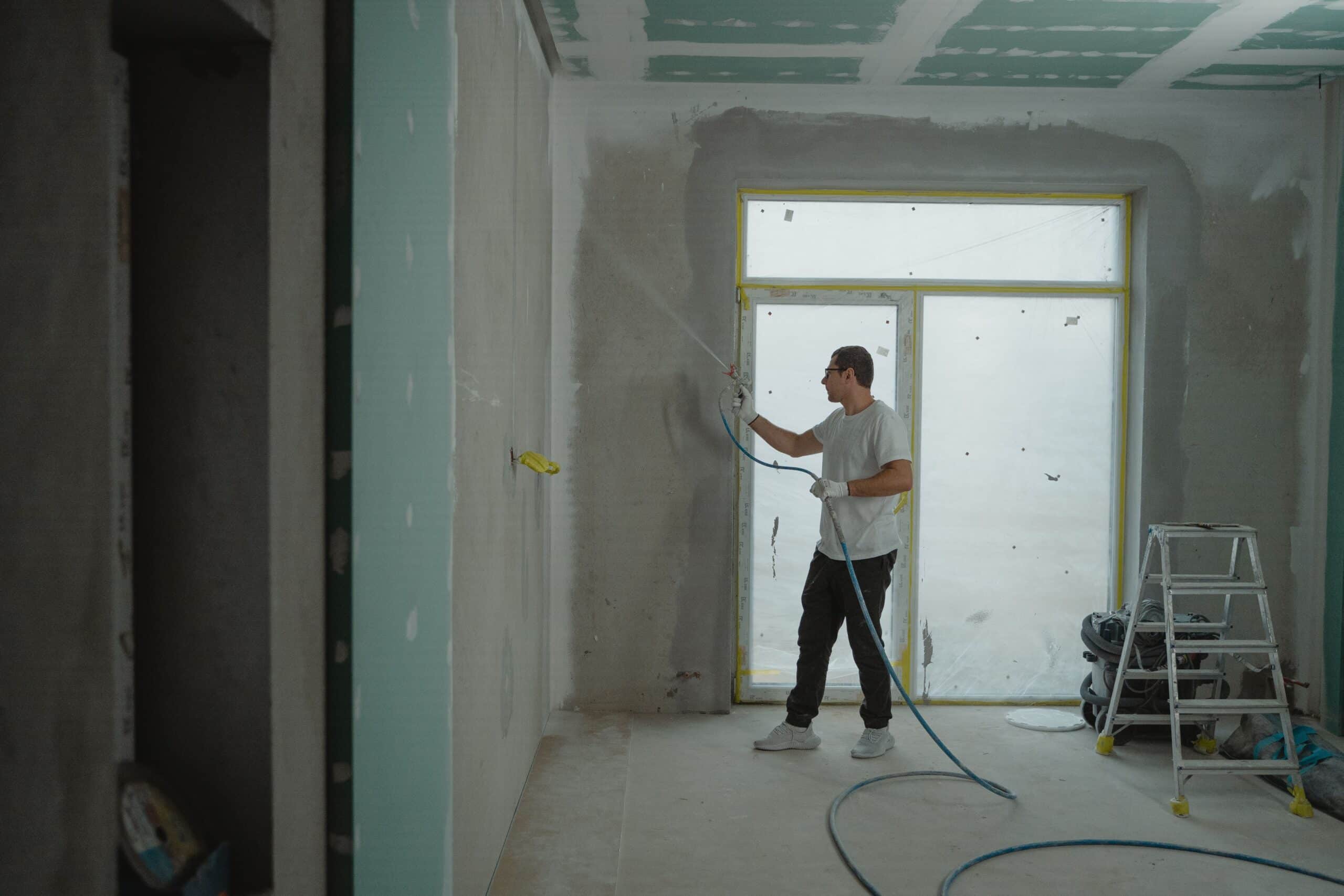 Man power cleaning a construction site
